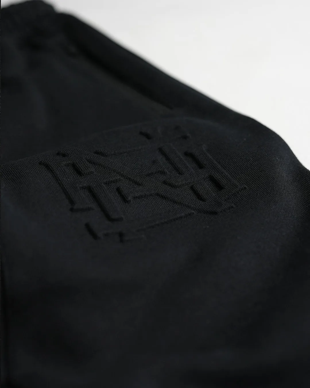 EMBOSSED FITTED JOGGERS-BLACK