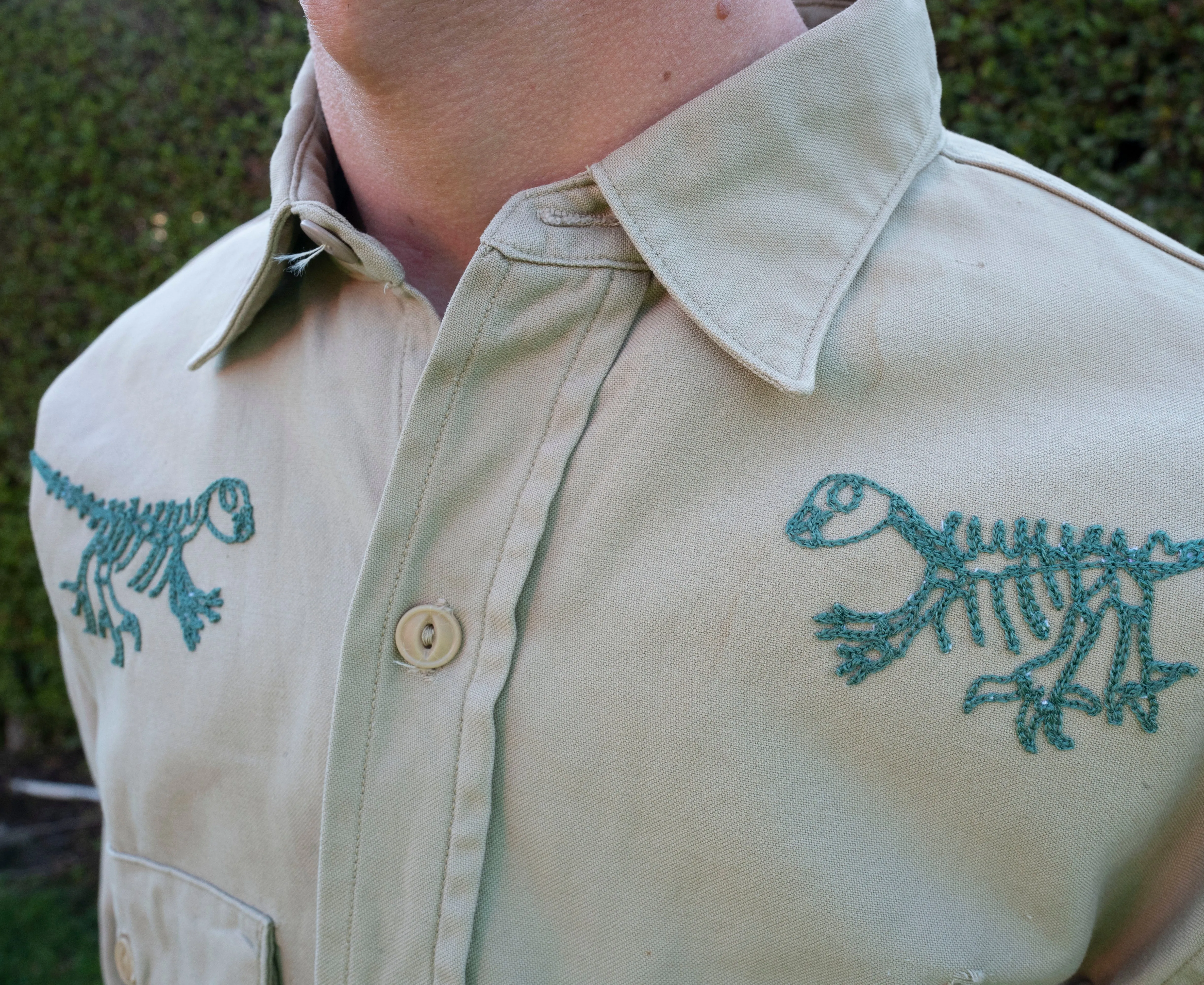 Long sleeve tan button up: two dino skeletons and now